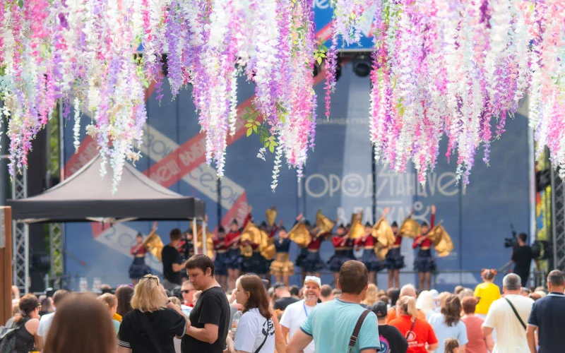 Festival crowd enjoying immersive theatre at Sydney Fringe with lanterns and pop-up stage in The Rocks
