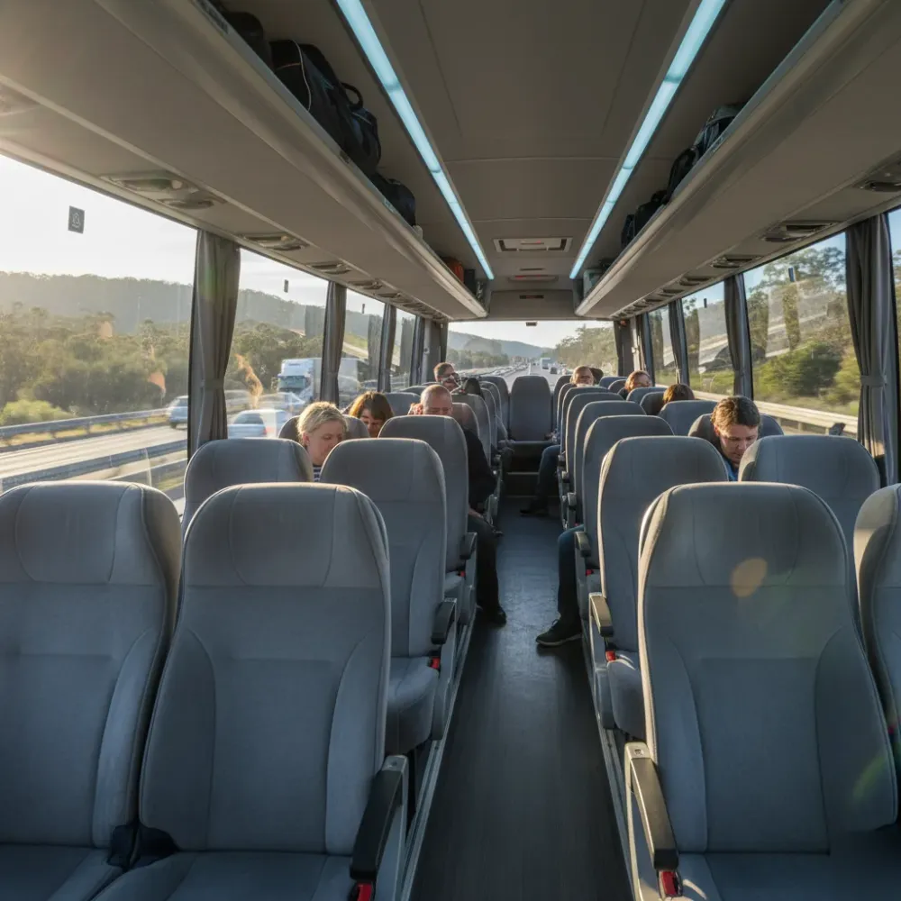 Charter bus interior in Sydney with motorway views outside windows